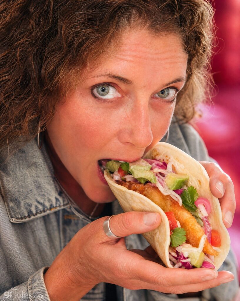 jules eating gluten free fried fish taco