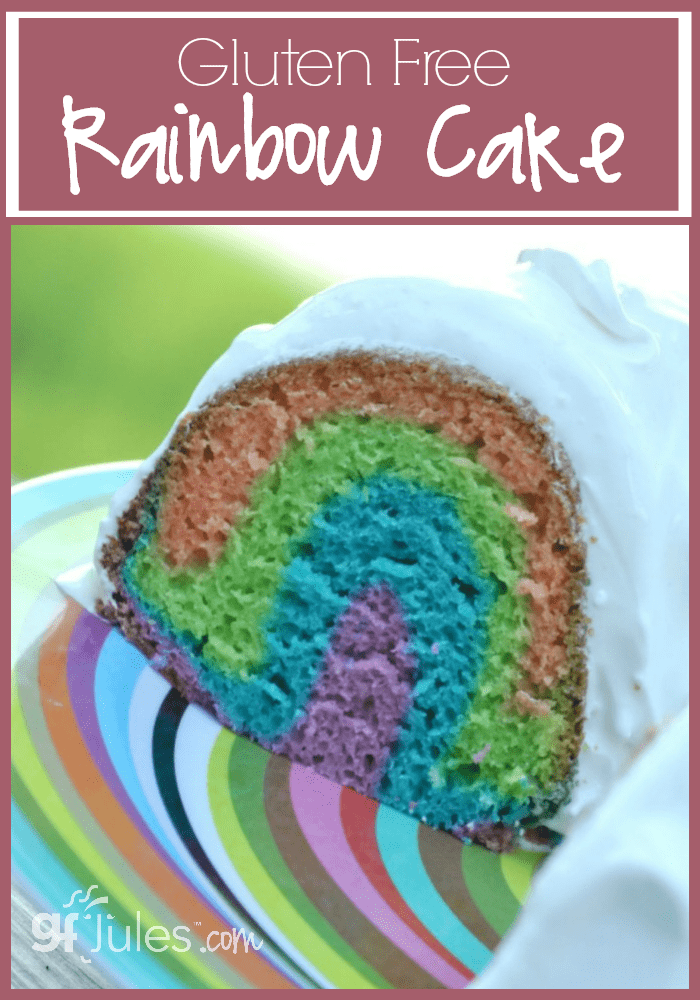 This Gluten Free Rainbow Cake with fluffy marshmallow frosting will brighten anyone's day! And because it's actually easy to make, you'll smile, too!