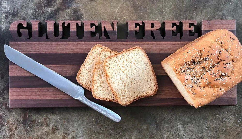 gluten free bread on Words with Boards board with knife