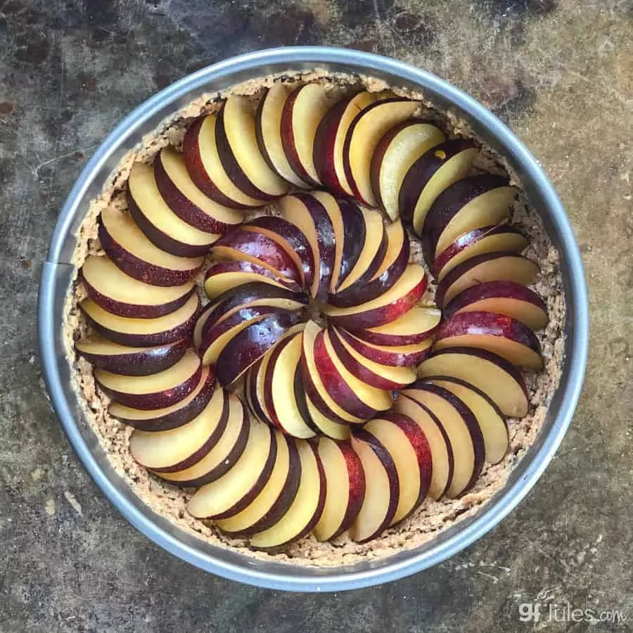 gluten free plum tart arranged plums