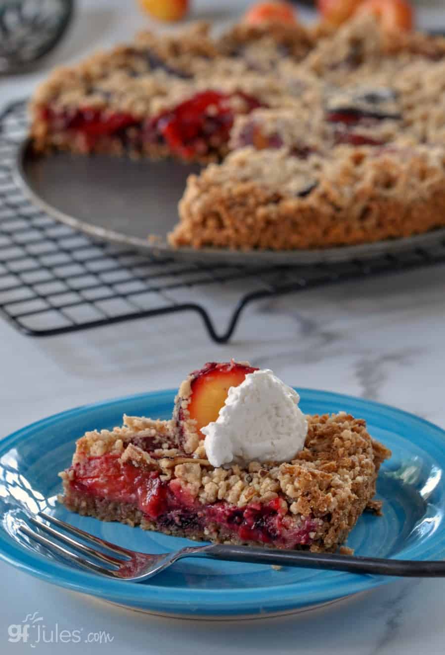 gluten free plum tart with whipped cream