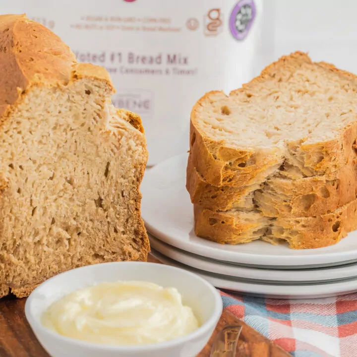 Sharing loaf of bread with saw stock photo