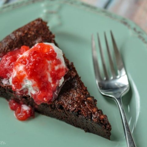 berry coulis on gluten free hot fudge pie