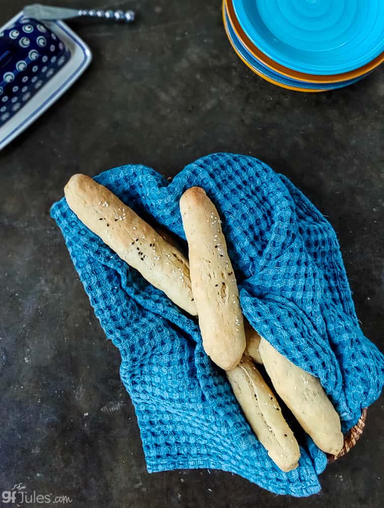gluten free bread sticks in basket overhead
