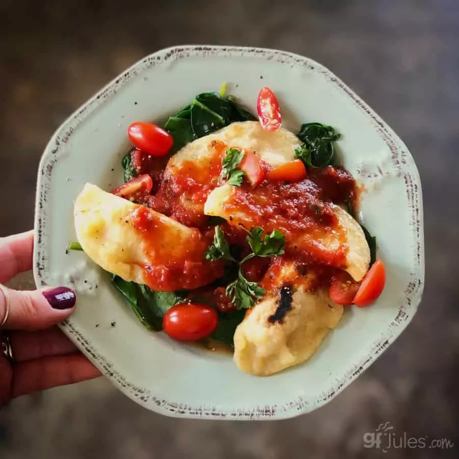 gluten free pierogi over spinach