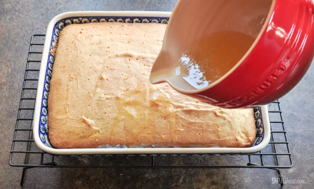 pouring syrup gluten free lemon cake