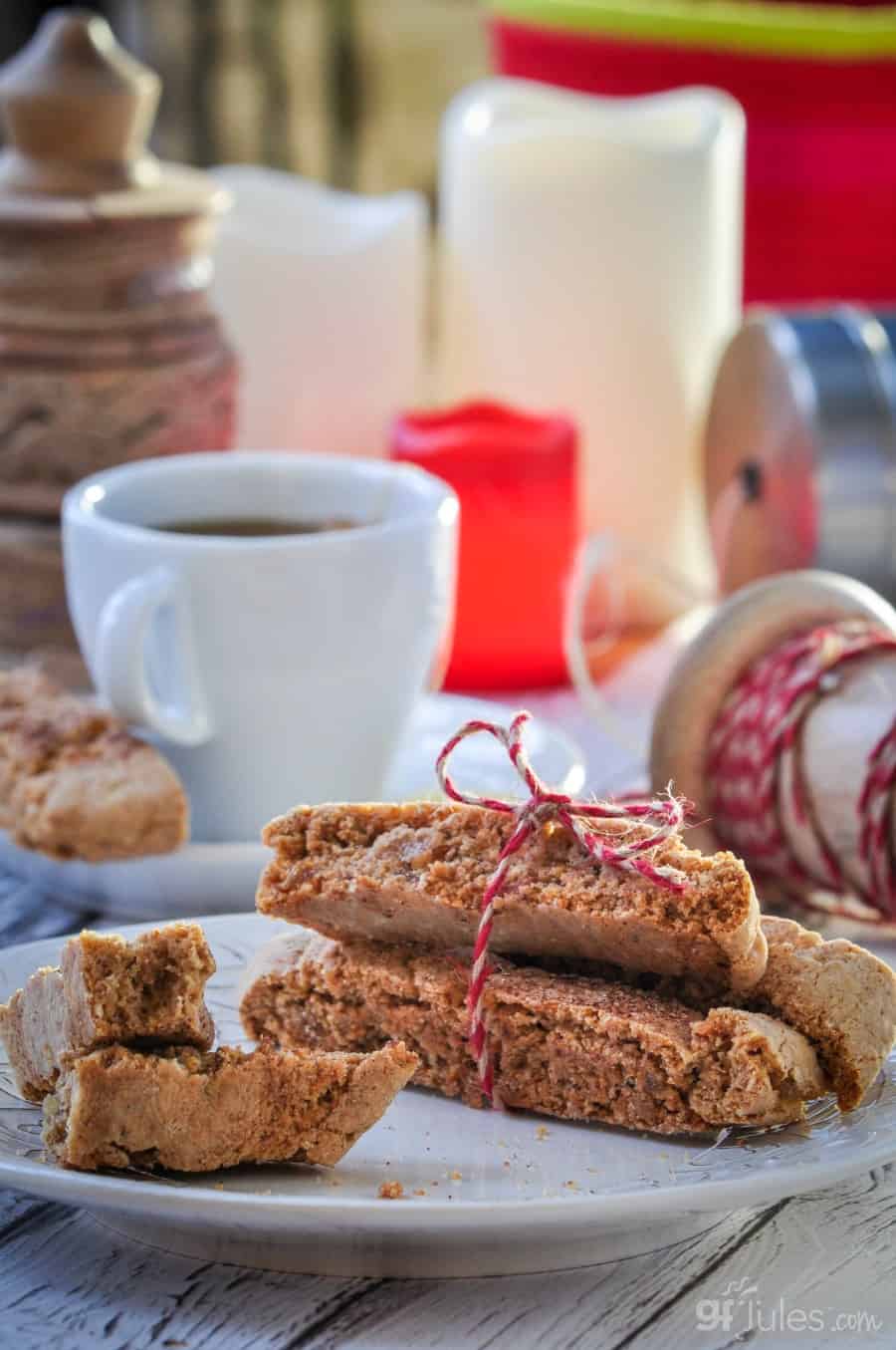 https://gfjules.com/wp-content/uploads/2017/12/Gluten-Free-Gingerbread-Biscotti-with-candles-and-ribbon.jpg