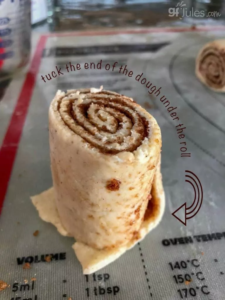 Tuck the end of the dough under the gluten free cinnamon roll