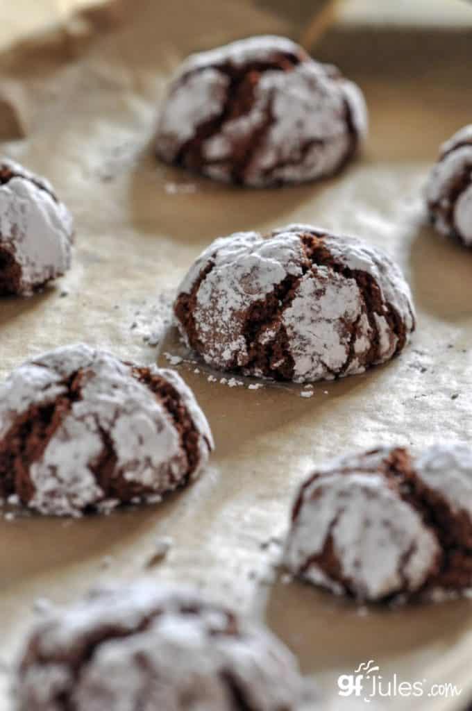 gluten free chocolate crinkle cookies on parchment 