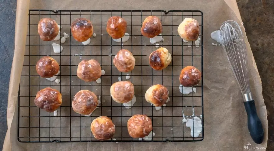 gluten free doughnut holes on rack on paper