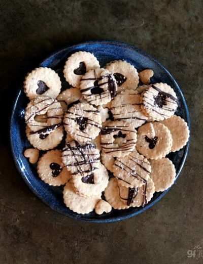 gluten free chocolate linzer cookies on plate