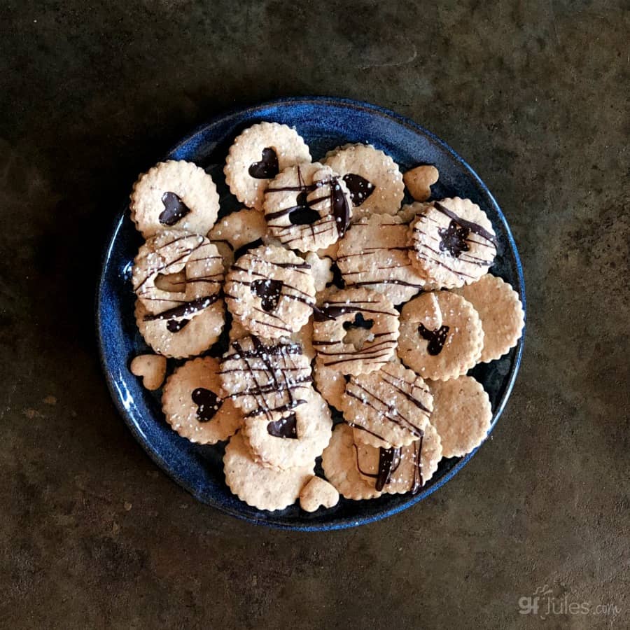 gluten free chocolate linzer cookies on plate