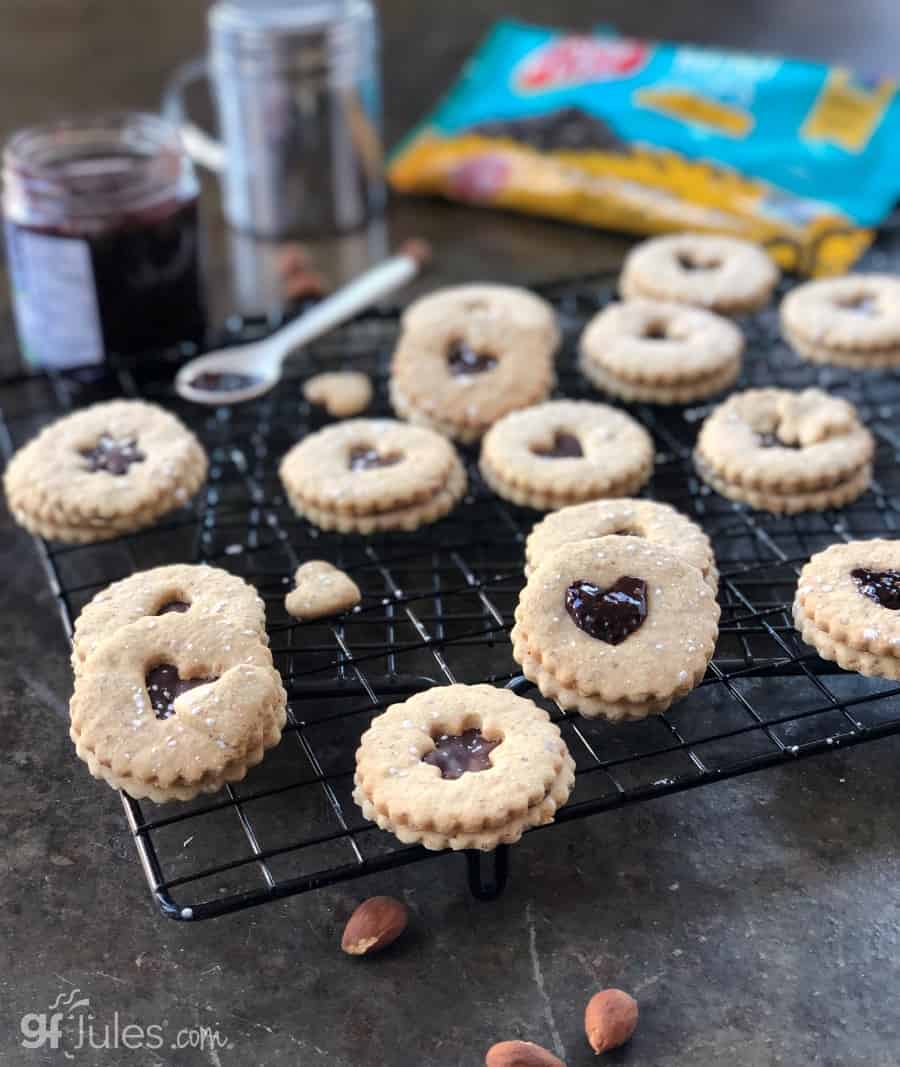 glutenfree chocolate linzer cookies on rack with enjoy life chips
