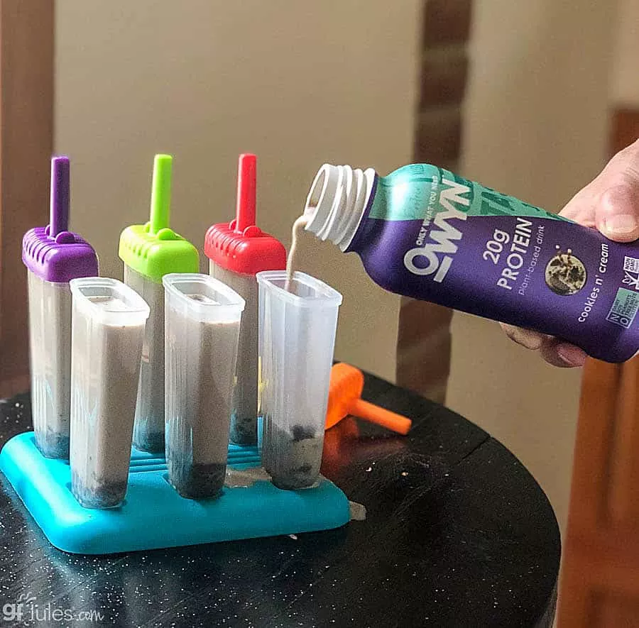 owyn pouring into popsicle molds