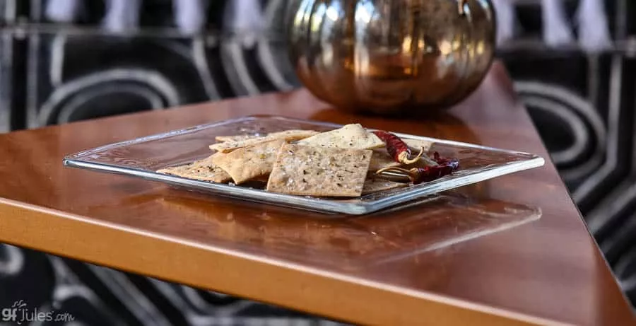 gluten free crackers on glass plate with pepper