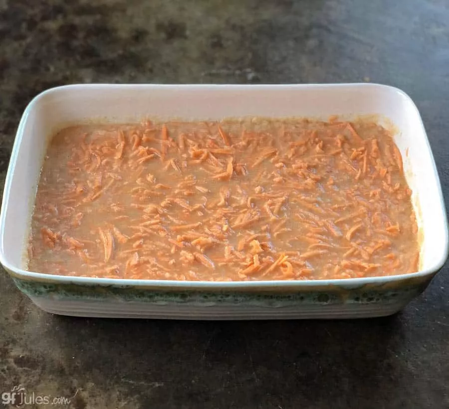 grated gluten free sweet potato casserole before baking