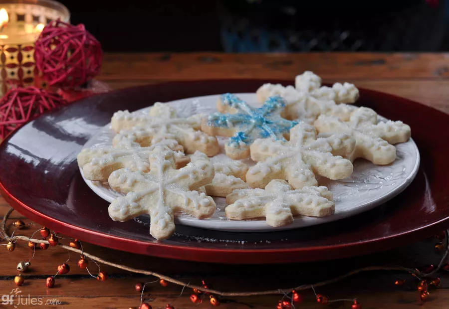gluten free cut out cookies snowflakes on plate with candle | gfJules_