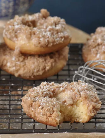 gluten free crumb donuts on rack with bite | gfJules