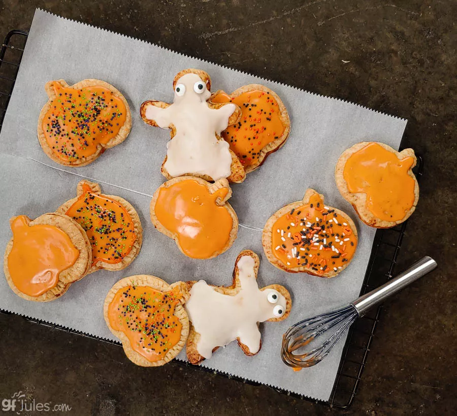 https://gfjules.com/wp-content/uploads/2020/10/gluten-free-poptarts-pumpkins-and-ghosts-on-parchment-gfJules.jpg