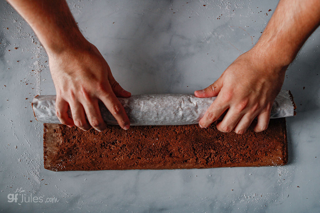 rolling up gluten free chocolate sponge cake for yule log