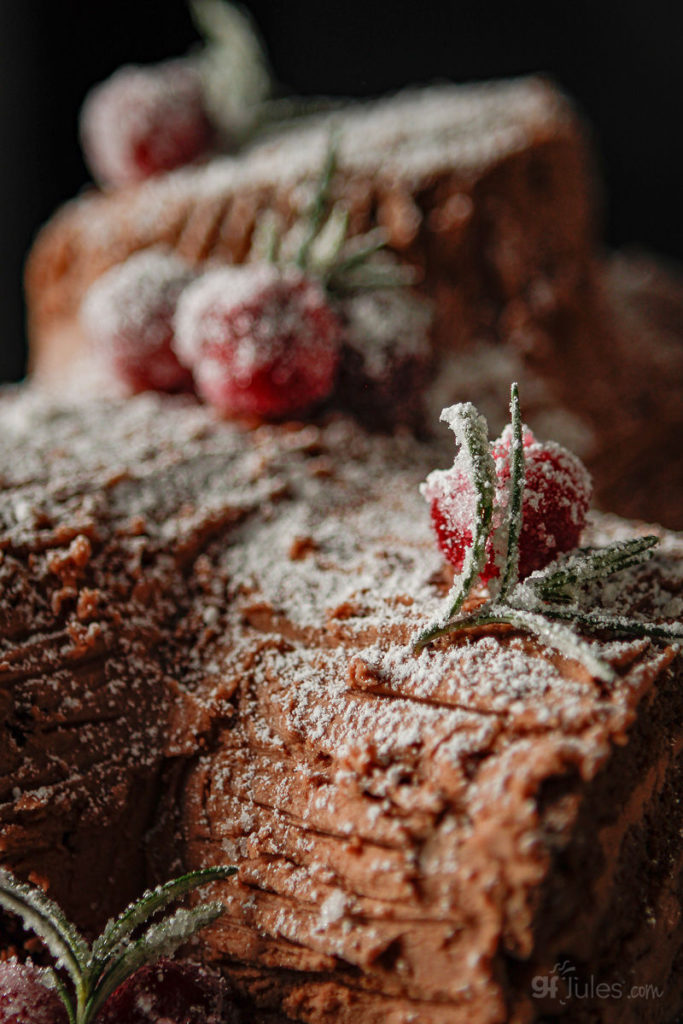 gluten free yule log with sugared cranberries and rosemary