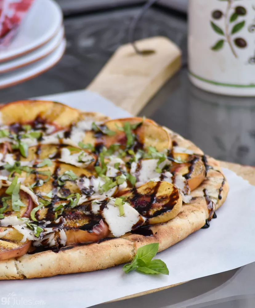 gluten free grilled peach pizza on peel with basil CU | gfJules