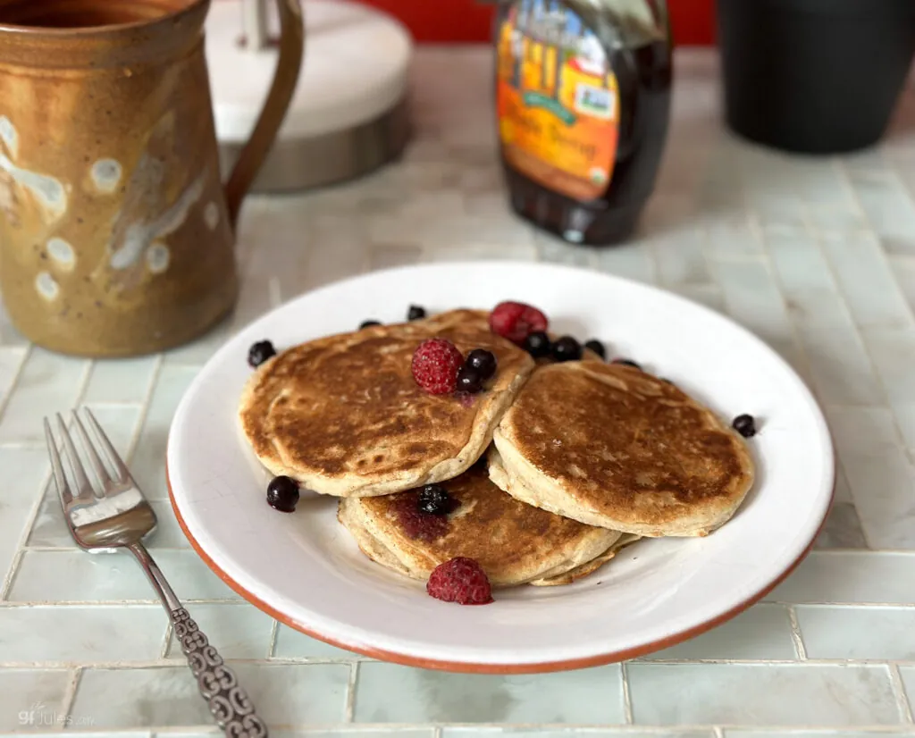 gluten free sourdough pancakes on plate with coffee mug