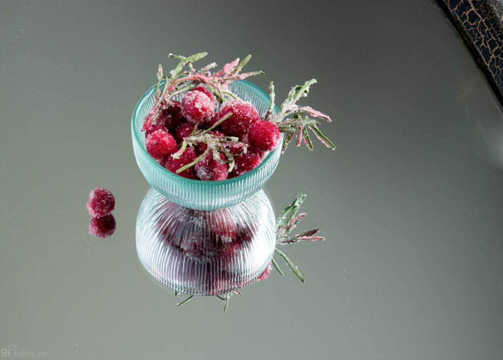 bowl of sugared cranberries and rosemary