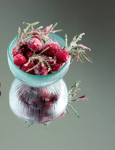 bowl of sugared cranberries and rosemary