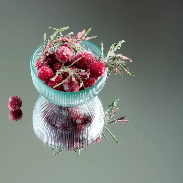 bowl of sugared cranberries and rosemary