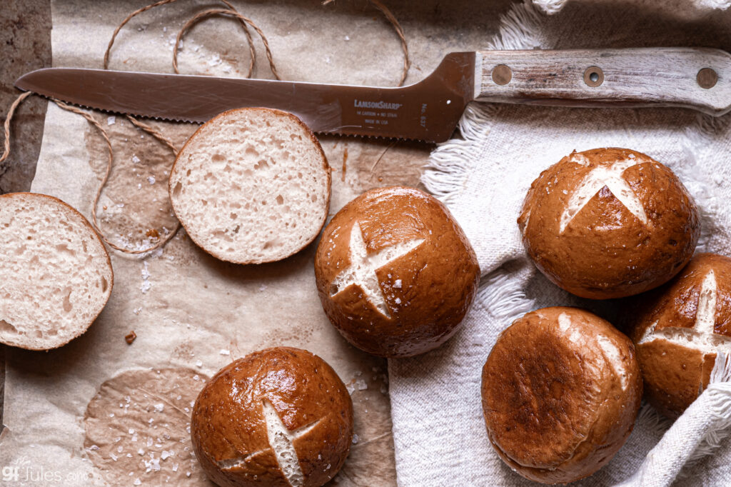 Soft, airy interior of a gluten free pretzel roll torn open to show the tender crumb and chewy crust.